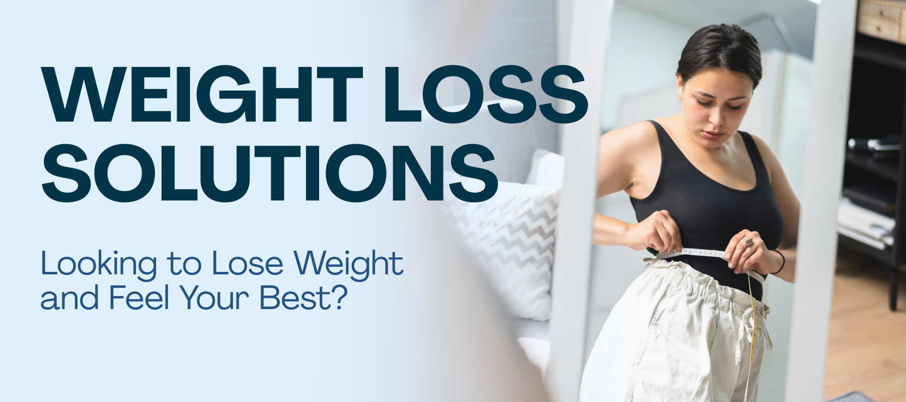 Person measuring waist with a tape measure in front of a mirror, promoting Revive Vitality Now's weight loss solutions